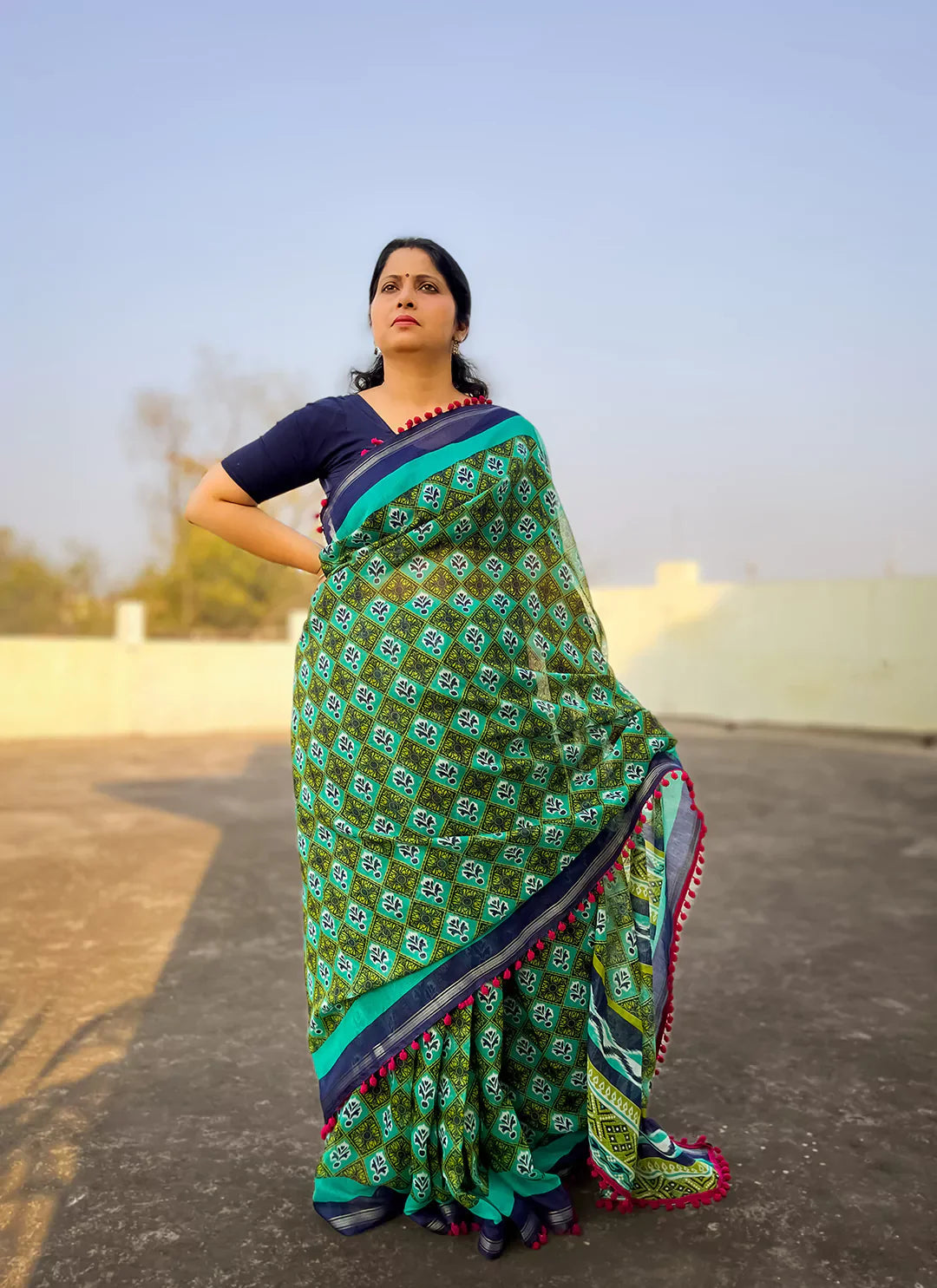 Printed Green Cotton Blend Saree With Pompoms treevesto