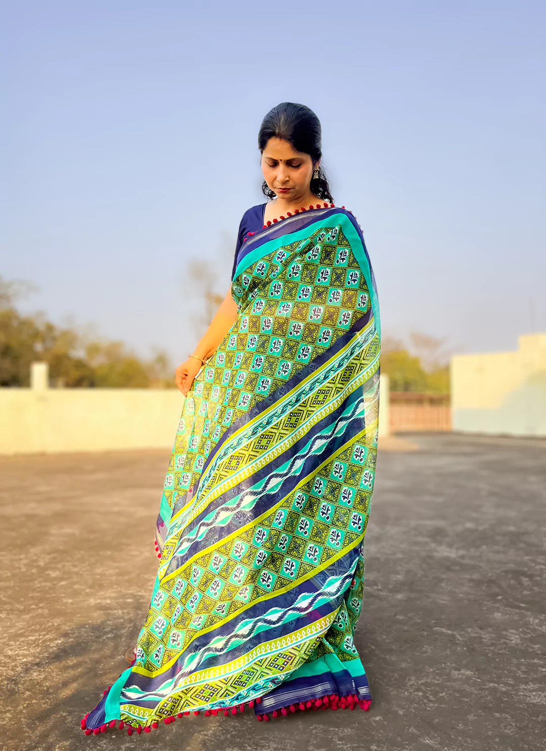 Printed Green Cotton Blend Saree With Pompoms treevesto