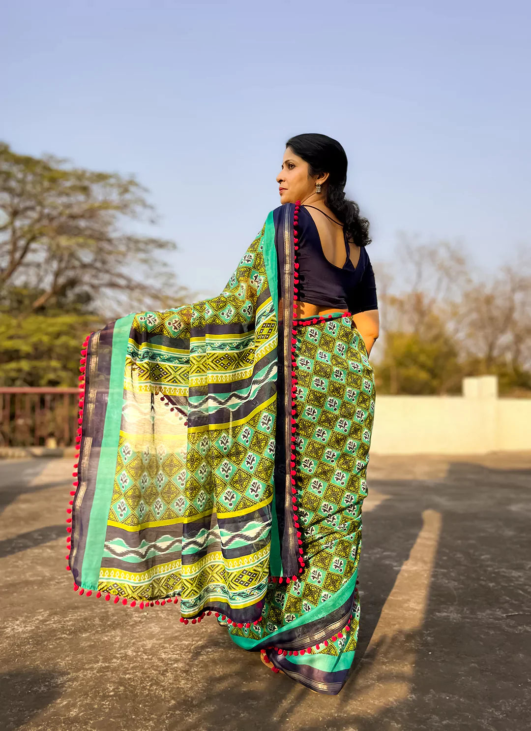 Printed Green Cotton Blend Saree With Pompoms treevesto