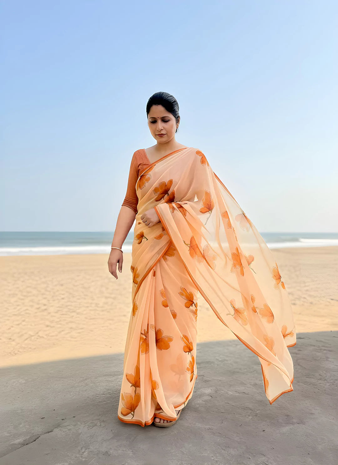 Floral Print Coral Colored Ultra Soft Weightless Chiffon Saree  TREEVESTO