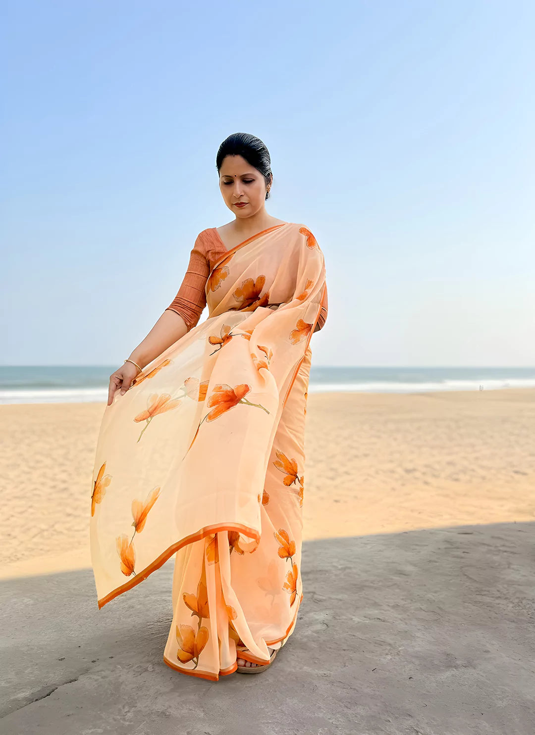 Floral Print Coral Colored Ultra Soft Weightless Chiffon Saree  TREEVESTO