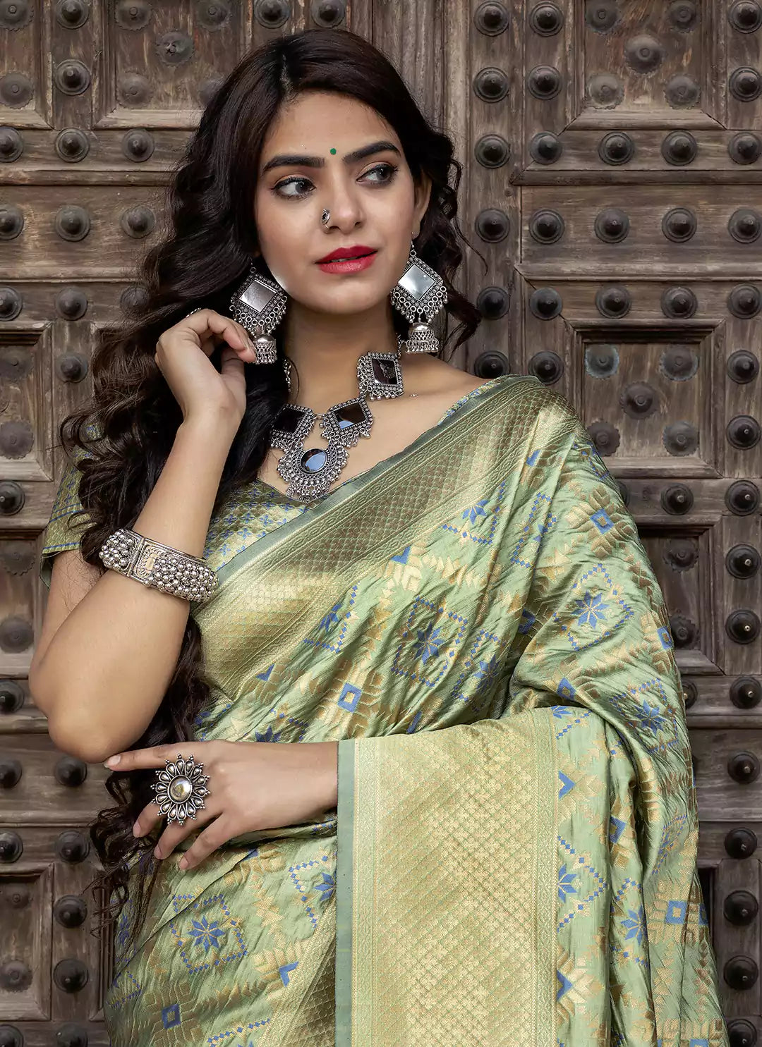 Patola Woven Pista Green Silk Saree - TREEVESTO