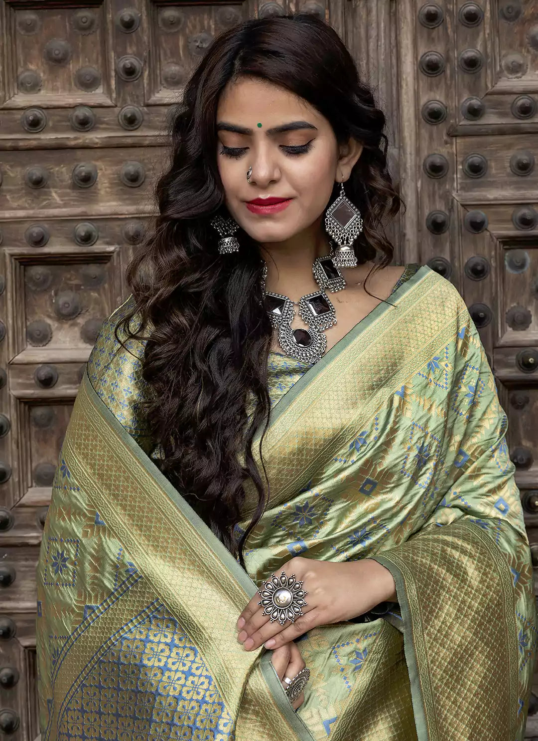 Patola Woven Pista Green Silk Saree - TREEVESTO
