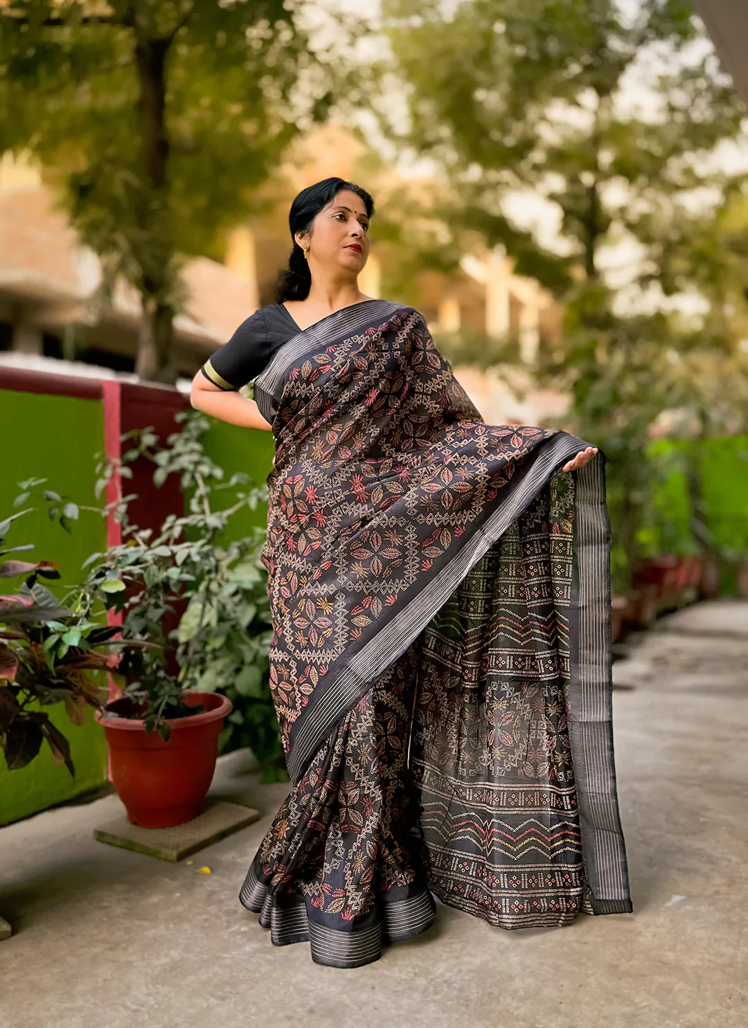 Printed Black Soft Dola Silk Saree With Zari Striped Border treevesto