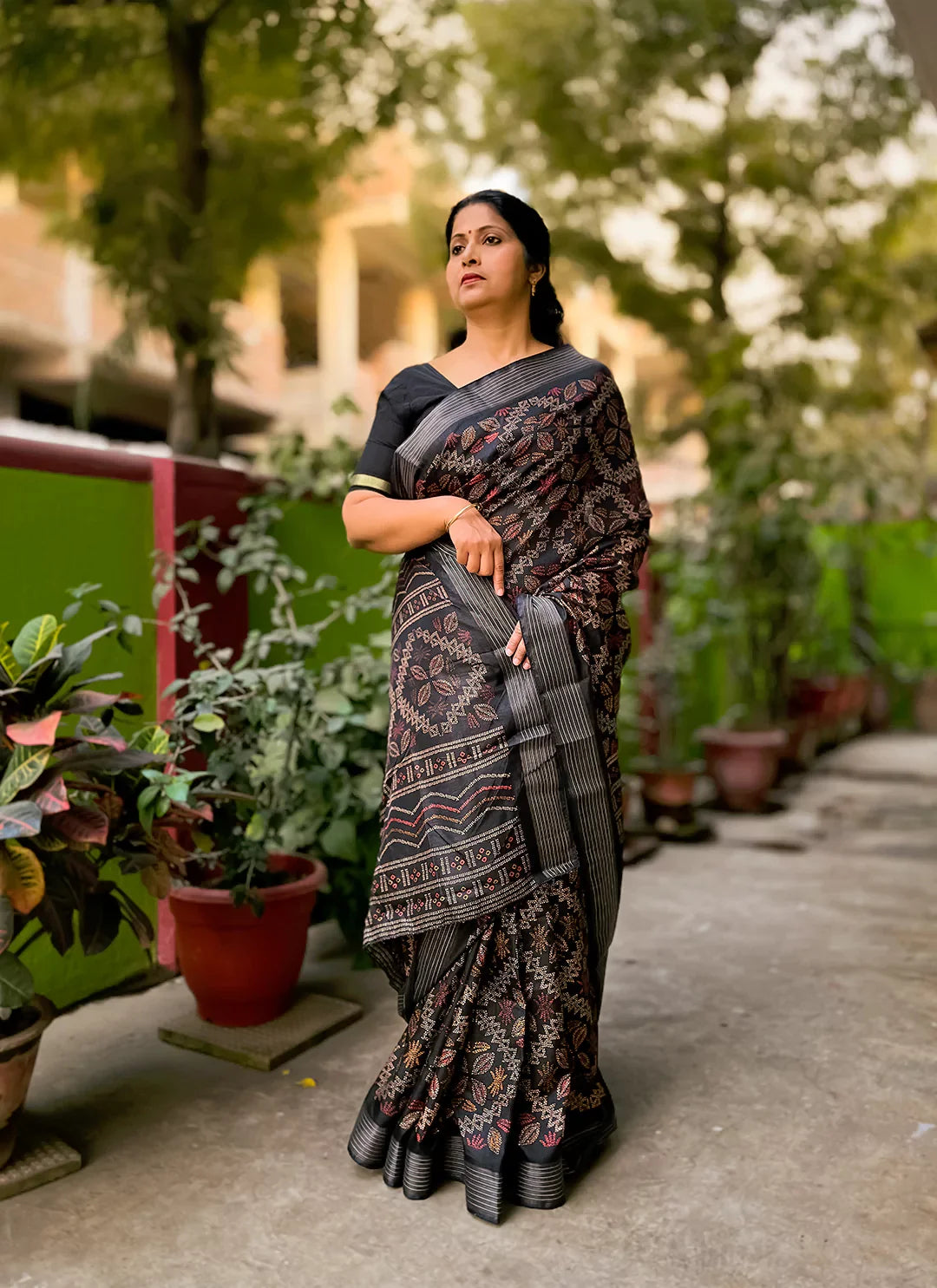 Printed Black Soft Dola Silk Saree With Zari Striped Border treevesto