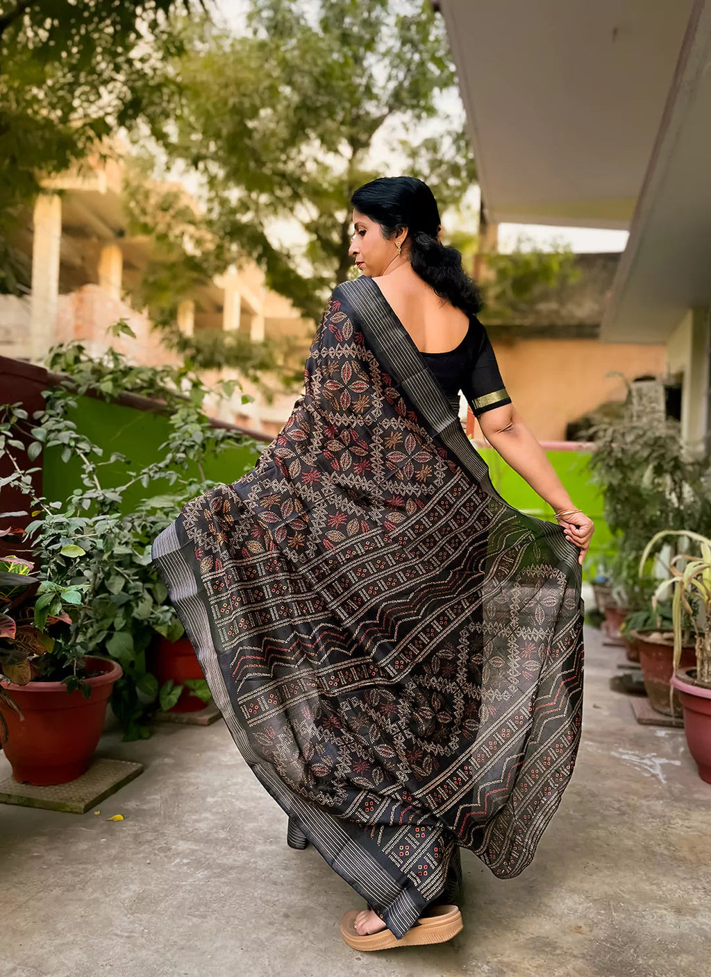 Printed Black Soft Dola Silk Saree With Zari Striped Border treevesto