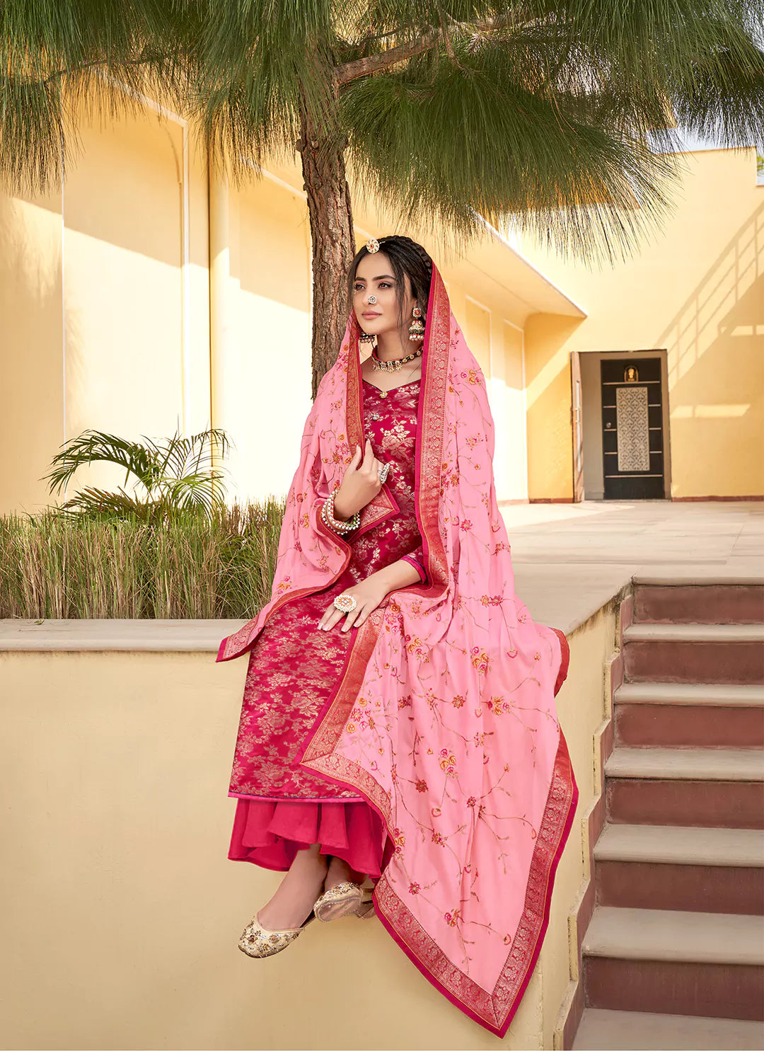 Rani Color Banarasi Silk Unstitched Suit With Heavy Work Dupatta treevesto